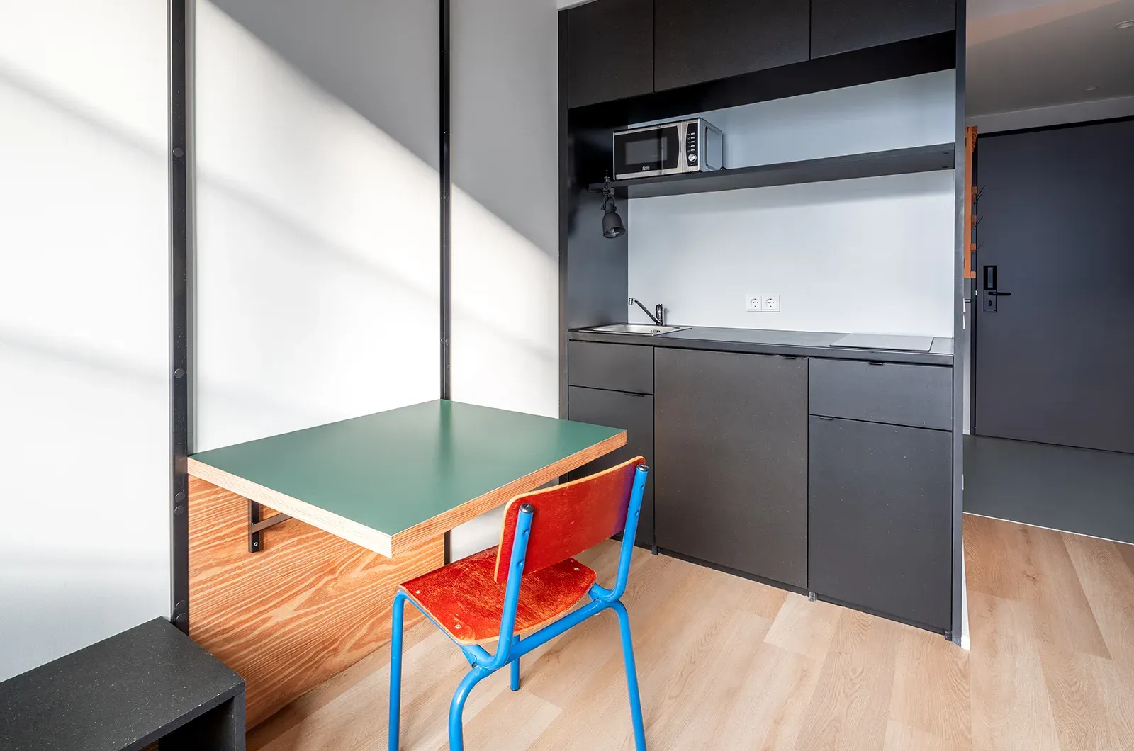 Undecorated kitchen and dining area in a Classic Room at Neon Wood Berlin Frankfurter Tor showing furnished baseline without styling accents