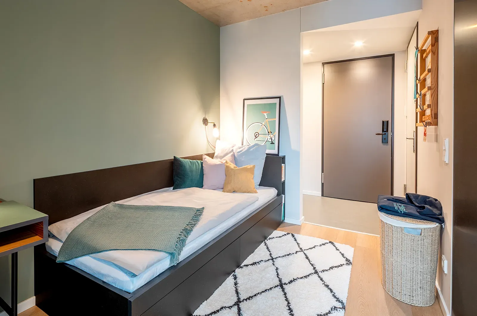 Styled bed area in a Classic Balcony Room at Neon Wood Berlin Frankfurter Tor showing decorated sleeping space and personalization example