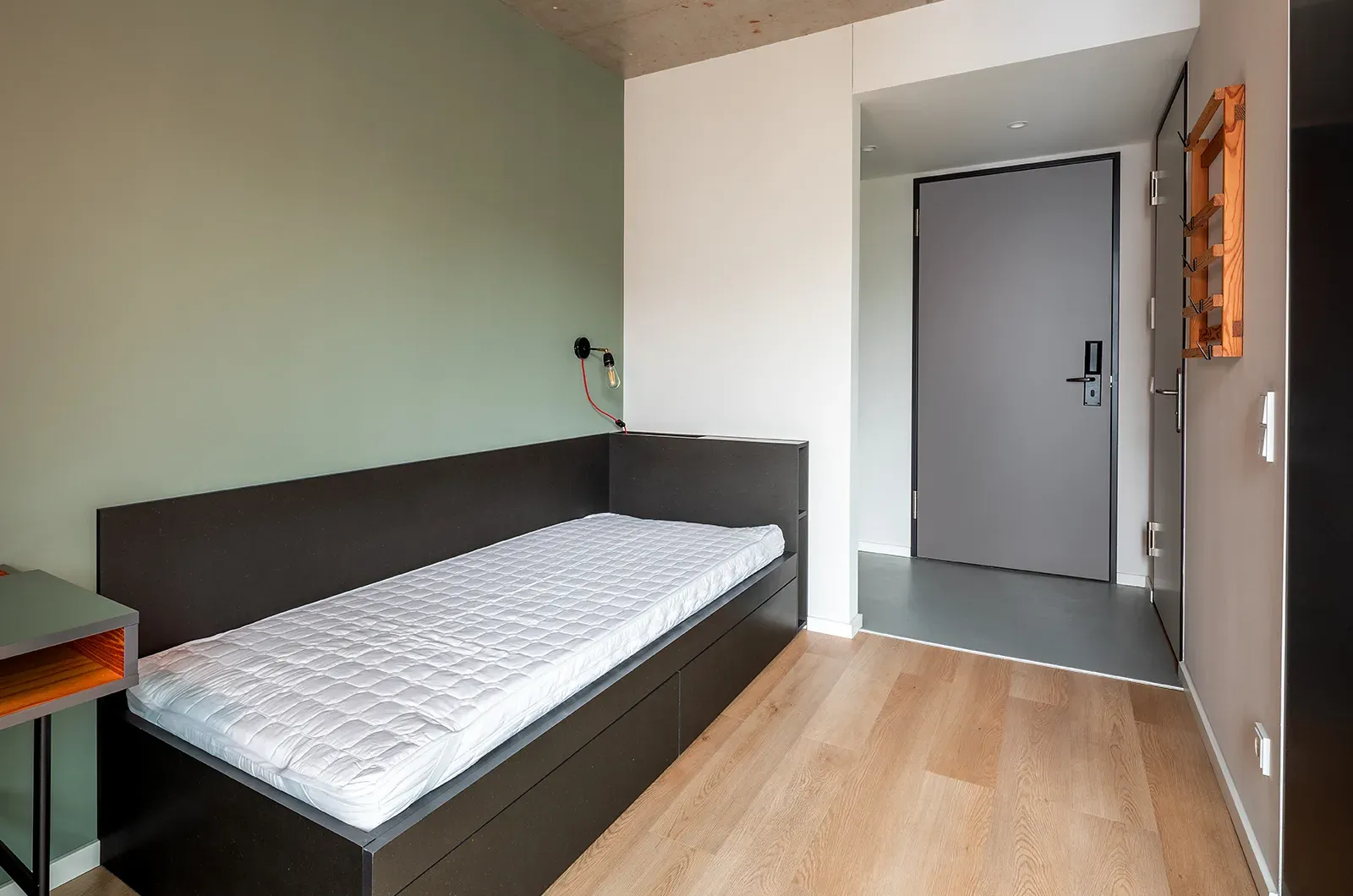 Undecorated bed area in a Classic Balcony Room at Neon Wood Berlin Frankfurter Tor showing furnished baseline without styling accents