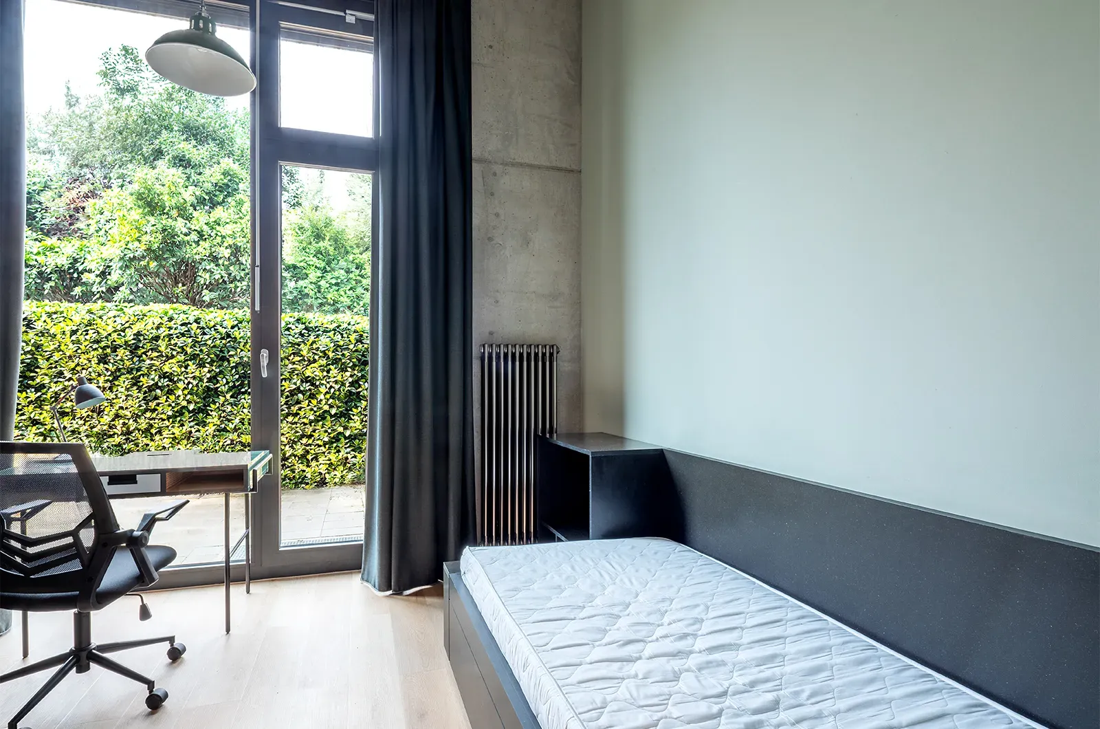 Undecorated bed area with access to the patio in a Classic Patio Room at Neon Wood Berlin Mitte-Wedding showing furnished baseline without styling accents