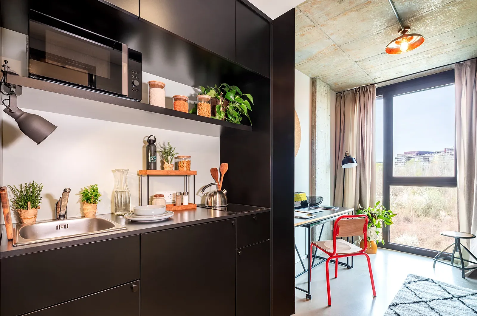 Styled kitchen and dining area in a room at Neon Wood Frankfurt Riedberg showing decorated space and personalization example